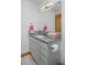 Bright bathroom with granite countertops, gray cabinets and modern fixtures at 14370 Osage St, Westminster, CO 80023