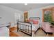 Cozy bedroom featuring wood floors and natural light at 14370 Osage St, Westminster, CO 80023