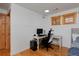 Bedroom featuring wood-trimmed windows and a desk area at 14370 Osage St, Westminster, CO 80023
