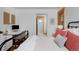 Bedroom with wood-trimmed window and bathroom access at 14370 Osage St, Westminster, CO 80023