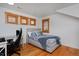 Comfortable bedroom with desk and natural light from wood-trimmed windows at 14370 Osage St, Westminster, CO 80023