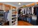 Walk-in closet with hardwood floors, built-in shelves, and ample storage, ideal for organization at 14370 Osage St, Westminster, CO 80023