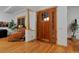 Inviting entryway showcasing hardwood floors, a wooden door, and elegant trim, creating a warm welcome at 14370 Osage St, Westminster, CO 80023