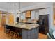 Bright kitchen with stainless steel appliances, granite countertops, and wooden floors at 14370 Osage St, Westminster, CO 80023