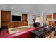 Spacious living room with built-in cabinets and large television at 14370 Osage St, Westminster, CO 80023