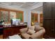 Charming office with wooden desk, comfortable chair, and bright natural light at 14370 Osage St, Westminster, CO 80023