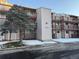 Exterior view of a condo building with snow on the ground at 8450 Decatur St # 102, Westminster, CO 80031