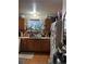 Kitchen with wood cabinets and a refrigerator at 8450 Decatur St # 102, Westminster, CO 80031