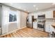 Kitchen with stainless steel appliances and light wood cabinets at 13637 E Evans Ave, Aurora, CO 80014