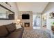 Living room with stone fireplace and hardwood floors at 13637 E Evans Ave, Aurora, CO 80014