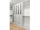 Well-organized closet with custom shelving, drawers, and glass-front cabinets provides ample storage space at 2160 Folsom St, Boulder, CO 80302