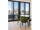Modern dining area with glass table, stylish seating, and sliding glass doors to the outside at 2160 Folsom St, Boulder, CO 80302