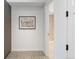 Hallway view featuring modern doors and a glimpse into a well-lit bathroom at 2160 Folsom St, Boulder, CO 80302