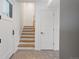Bright hallway featuring a staircase, tiled floor and modern doors at 2160 Folsom St, Boulder, CO 80302