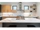 Modern kitchen with marble countertops, stainless steel appliances, and open shelving at 2160 Folsom St, Boulder, CO 80302