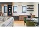 Bright living room with custom cabinets, modern lighting, and dining area with outdoor access at 2160 Folsom St, Boulder, CO 80302