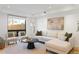 Bright living room features a comfortable sectional sofa, stylish seating, and an abstract art piece at 2160 Folsom St, Boulder, CO 80302