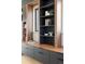 Close up of the custom built-in shelving and storage with decorative touches in the living room at 2160 Folsom St, Boulder, CO 80302