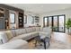Open living room featuring a large sectional sofa, custom shelving, and natural light at 2160 Folsom St, Boulder, CO 80302