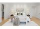 Stylish main bedroom features a plush bed, modern lamps, and a cozy bench at the foot of the bed at 2160 Folsom St, Boulder, CO 80302