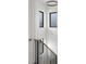 Modern staircase with dark metal railing and natural wood steps offers a sleek and stylish design at 2160 Folsom St, Boulder, CO 80302