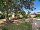 Spacious backyard featuring a shed with a rustic log-burning fire pit at 14050 E 25Th Pl, Aurora, CO 80011