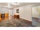 A spacious finished basement featuring a work area, storage trunk and access to stairs at 14050 E 25Th Pl, Aurora, CO 80011