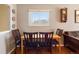 Cozy dining area showcasing a wooden table with chairs, hardwood floors, and natural light, perfect for Gathering meals at 14050 E 25Th Pl, Aurora, CO 80011