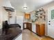 Compact kitchen featuring essential appliances, practical storage solutions, and natural light, perfect for everyday cooking needs at 14050 E 25Th Pl, Aurora, CO 80011