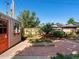 Cozy garden shed with window box, brick patio and raised garden bed at 14050 E 25Th Pl, Aurora, CO 80011