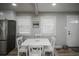 Dining room featuring a white table and ample natural light at 2696 S Grove St, Denver, CO 80219
