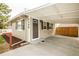 Charming home featuring an inviting entrance and convenient covered carport at 2696 S Grove St, Denver, CO 80219