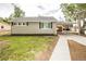 Cozy one-story home featuring a covered carport and newly landscaped front yard at 2696 S Grove St, Denver, CO 80219