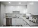 Bright kitchen featuring stylish countertops and modern appliances at 2696 S Grove St, Denver, CO 80219