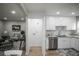 Open-concept kitchen featuring ample cabinet space and modern finishes at 2696 S Grove St, Denver, CO 80219