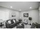Inviting living room featuring light hardwood floors and modern decor at 2696 S Grove St, Denver, CO 80219
