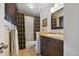 Bathroom featuring a vanity, framed mirror, decorative shower curtain, and tiled floors at 16326 E Dorado Ave, Centennial, CO 80015