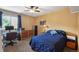 Bright bedroom with a ceiling fan, natural light, and comfortable furnishings at 16326 E Dorado Ave, Centennial, CO 80015