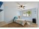 Bedroom with light blue walls, carpet, and a window with blinds at 16326 E Dorado Ave, Centennial, CO 80015