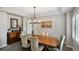 Elegant dining room with a chandelier, wooden furniture, and neutral color scheme at 16326 E Dorado Ave, Centennial, CO 80015