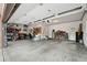 A spacious and organized garage with ample storage, tools, and room for vehicles at 16326 E Dorado Ave, Centennial, CO 80015