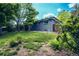 A spacious, lush backyard with mature trees and well-maintained lawn at 4854 S Parfet St, Littleton, CO 80127
