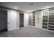 Basement area showcases storage, built-in shelves, and closet space, creating functional and organized living at 4854 S Parfet St, Littleton, CO 80127