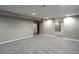 Finished basement with neutral carpet, offering access to storage and other areas, expanding living possibilities at 4854 S Parfet St, Littleton, CO 80127