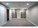 Basement featuring built-in shelving and storage, offering organized spaces and a versatile living area at 4854 S Parfet St, Littleton, CO 80127