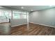 Open-concept living area with wood floors and views of the contemporary kitchen at 4854 S Parfet St, Littleton, CO 80127
