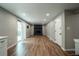 Spacious living room showcasing hardwood floors, a cozy fireplace, and a sliding glass door for natural light at 4854 S Parfet St, Littleton, CO 80127
