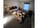Bedroom with large window and a bed covered with clothes and clutter at 14131 E Baltic Pl, Aurora, CO 80014