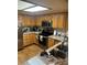 Updated kitchen with granite countertops, stainless steel appliances, and wood cabinets for a modern look at 14131 E Baltic Pl, Aurora, CO 80014