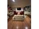 Living room with cozy seating and wood floors decorated with art and memorabilia at 14131 E Baltic Pl, Aurora, CO 80014